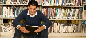 boy and book in library